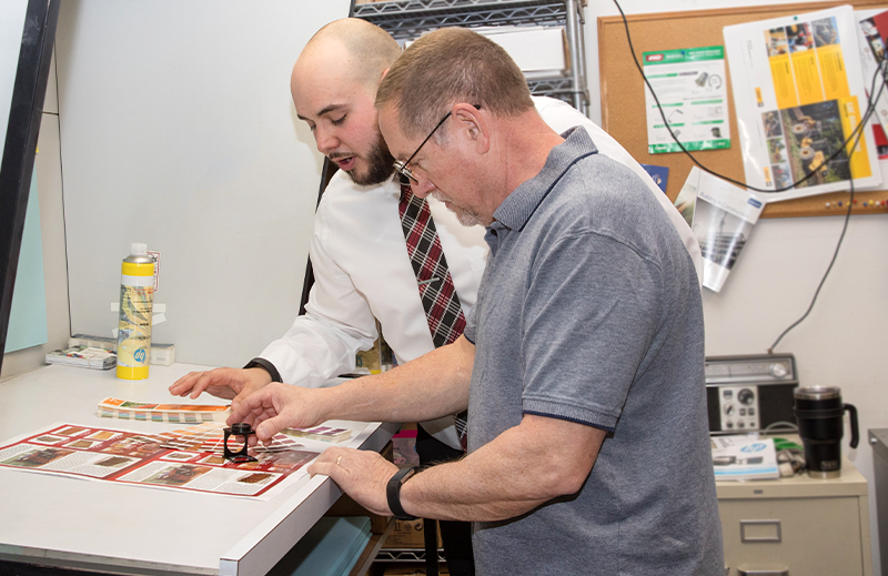 checking a sheet of printed paper for color